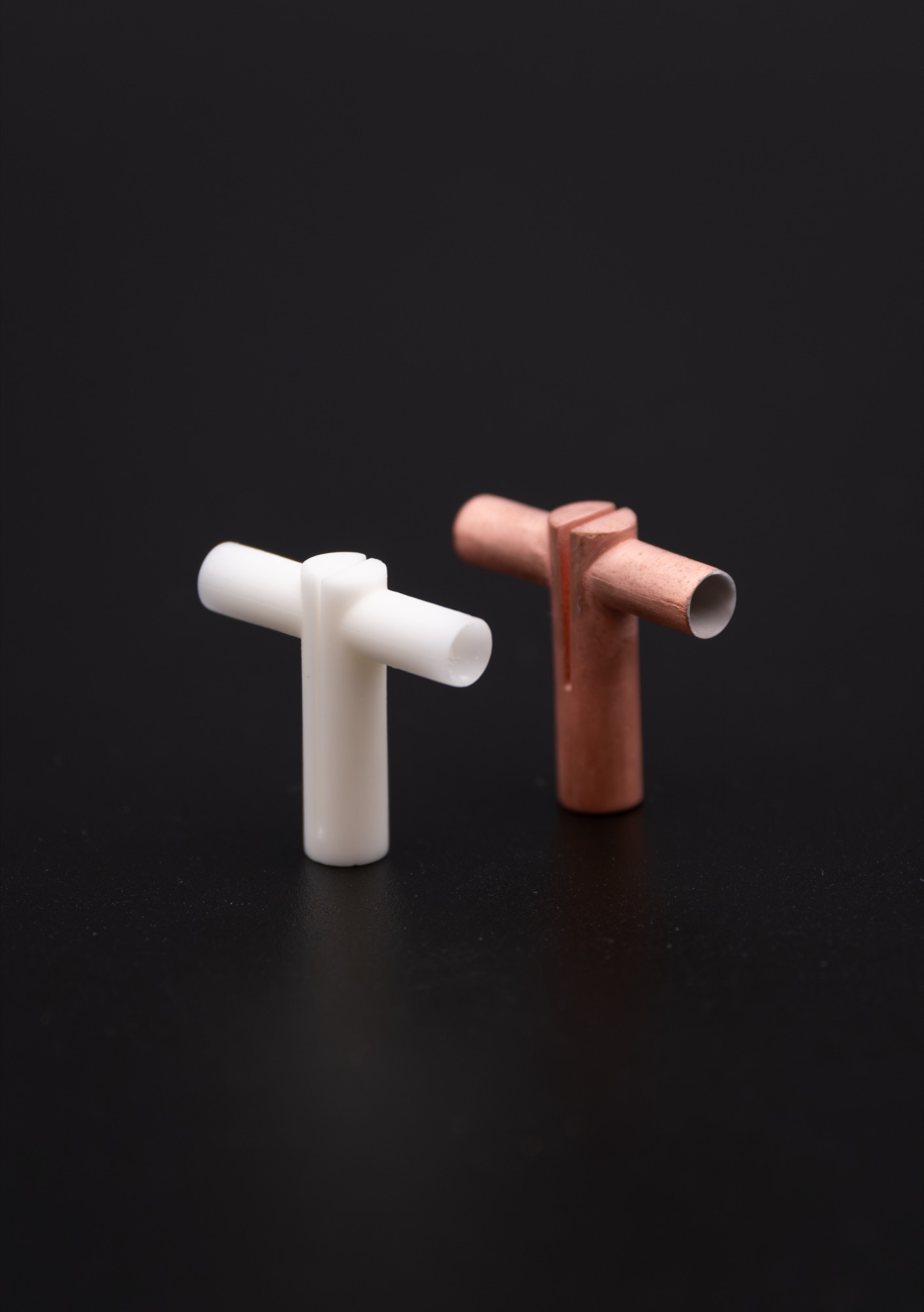 3D printed and 3Dprinted, then metallized part side by side.